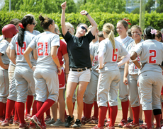 Assistant softball coach Leah Peterson, center, celebrates the Colonels 9-1 victory over Central Arkansas Sunday. The Colonels are now ranked third in the Southland Conference.