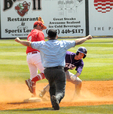 A Stephen F. Austin player is called safe as senior infielder Brady Bourque rushes to tag him during Sundays 17-10 loss.