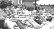 Students gathered in front of John L. Guidry Stadium eat crawfish during Crawfish Day 2008.