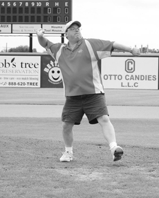 Dr. Glenn Antizzo throws the first pitch of the May 16 baseball game against Texas State, the last home game of the season.  The Colonels won 6-2.