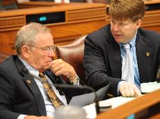 Representatives Harvey LeBas, from Ville Platte, and Lowell Hazel, from Pineville, confer May 24 during a debate of a bill that would allow an increase in tuition at public universities under certain guidelines.