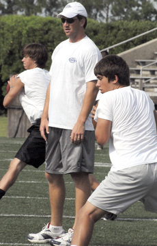 New York Giants quarterback Eli Manning supervises a drill in Guidry Stadium July 11 at the Manning Passing Academy.