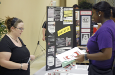 Sarabeth Theriot, mass communication sophomore from Thibodaux, talks to incoming freshman Cherise Thomas about joining the Student Government Association during the Aug, 16 freshmen orientation in the Cotillion Ballroom