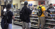 Students wait in line to check out Tuesday at the Bookstore.