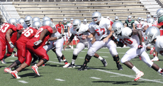 The football team begins its Aug. 21 intra-squad scrimmage in Guidry Stadium.