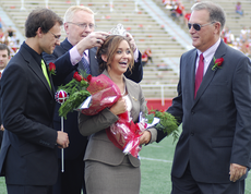 University president Stephen Hulbert crowns Whitney Dupuy, government senior from Morgan City, homecoming queen at last years football game against Jacksonville State.