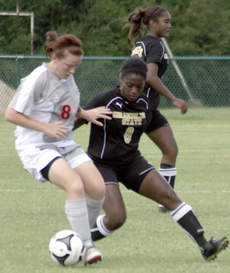 Junior middle Sam Etherington from Newcastle, England, guards the ball from a Grambling player during Sundays game. The Colonels won 6-2.