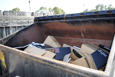 Hundreds of 2009 yearbooks lie in the dumpster outside of Student Publications Nov. 12.