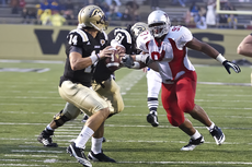 Junior defensive lineman A.J. Carter tries to block a Western Michigan player during the Sept. 11 game.
