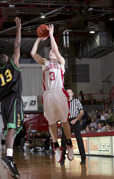 Former guard Mike Czepil, who is now an assistant basketball coach, tries to get past a Southeastern player during the January 14, 2006 game.