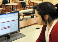 Hannah Songe, freshman from Houma, checks Blackboard on Monday in the student union.