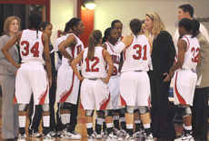Members of the womens basketball team gather to listen to head coach DoBee Plaisance during Fridays game against Southern University-New Orleans.