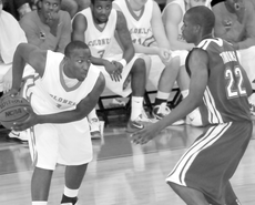 Freshman guard Dantrell Thomas tries to get past a Tulane player during the Nov. 26 game.
