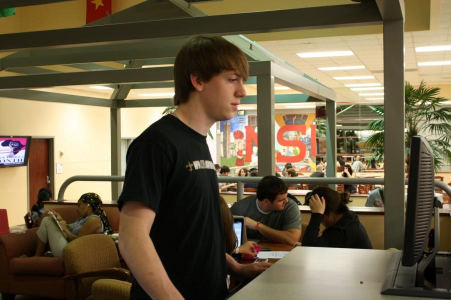Adam Roberts a Sophomore History major from Vidalia, checks his new Gmail in the Student Union on February 25th. Adam says that he is not a fan of the new system. 