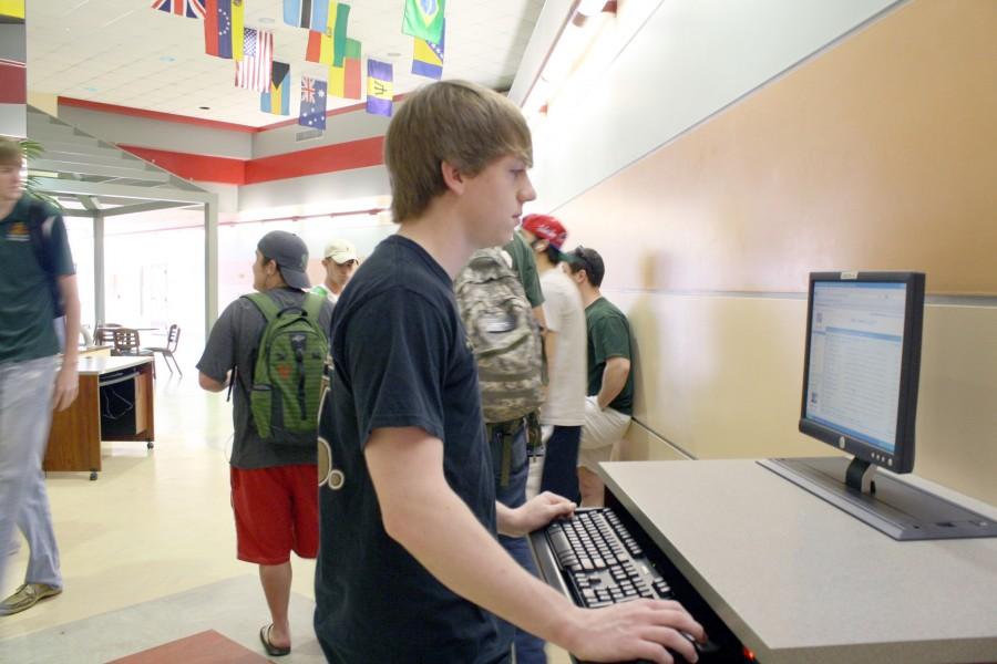 Adam Roberts, history sophomore from Vidalia, checks his e-mail on the new Gmail system on Friday in the Student Union. Roberts said he is not a fan of the new system.