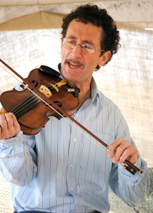 John Babin plays fiddle and sings Friday during the Louisiana Swamp Stomp Festival.