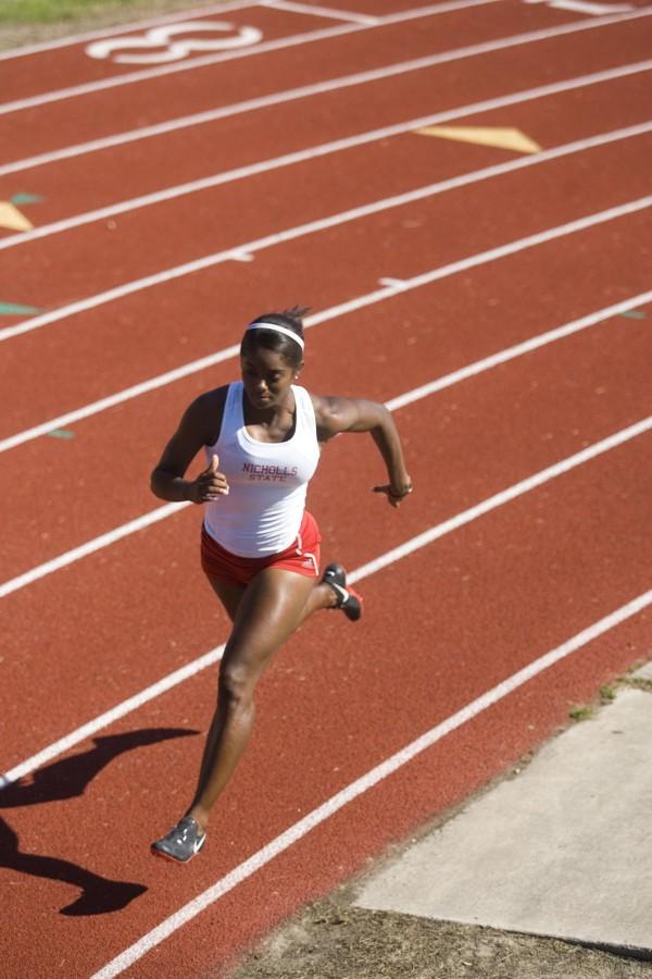 Junior sprinter Samantha Calhoun practices at E.D. White Catholic High School’s track.