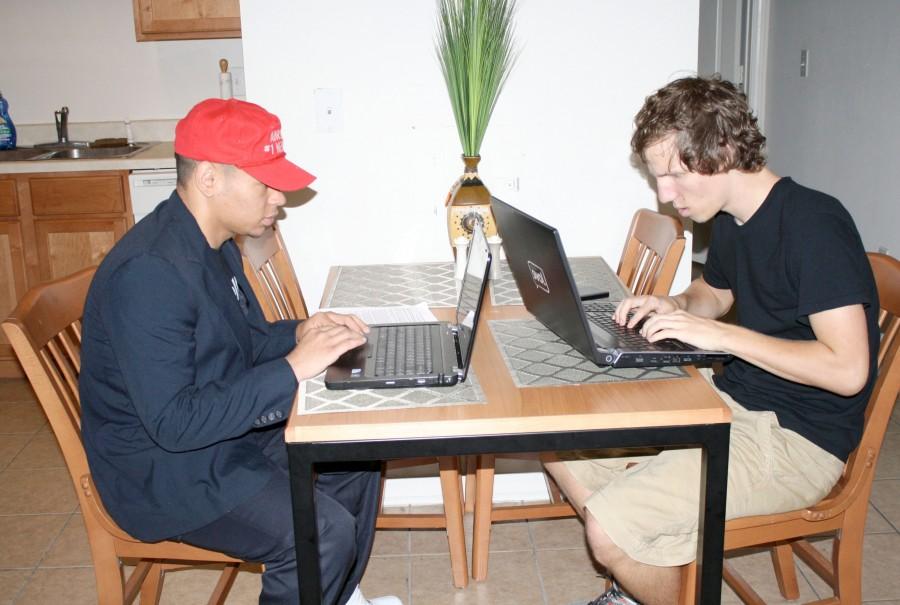 SickFreak Inc. founders Adrian Bourgeois, accounting junior from Raceland, and Derek Matherne, graphic design junior from Destrehan, try to catch online child predators on Monday at the organization’s headquarters.