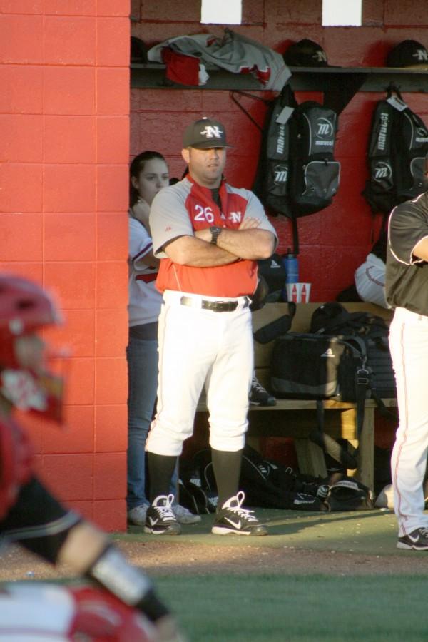 Baseball associate head coach Chris Prothro watches the catcher and official during the April 1 game against the University of Texas at Arlington.