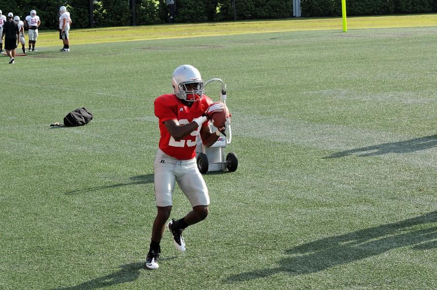 Defensive back Jonathan Gibson from Marrero catches the ball while practicing for the football scrimmage Sat. Aug. 13.