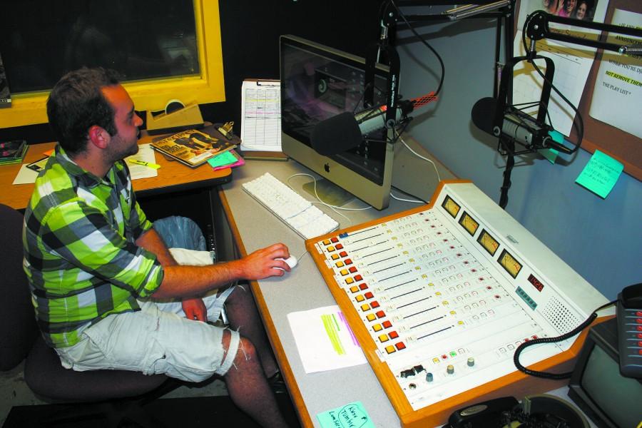 Nick Gremillion, MCBJ senior from Covington, works in the KNSU radio studio on Wednesday.