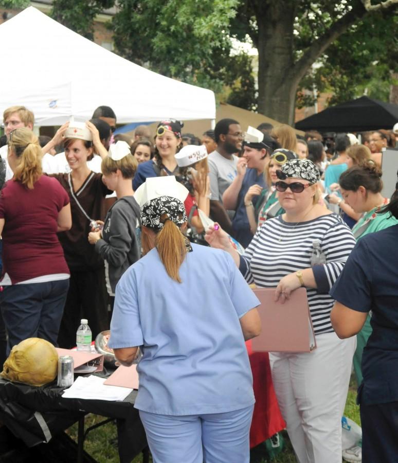 Nursing students flood the sidewalk next to the nursing table at Welcome Back Day Aust. 26, 2010.