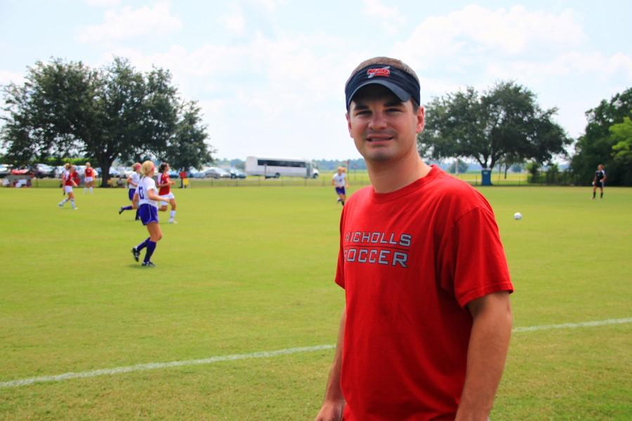 Flanking the sidelines of the soccer field as the Lady Colonels take on Spring Hill, Brandon Ruttley displays his support for Nicholls athletics on Aug. 19.
