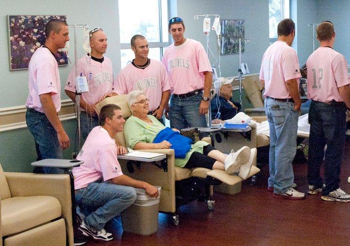 Members of the Nicholls baseball team visit cancer patients at Thibodaux Regional Medical Center before last season’s Pink game benefitting breast cancer awareness.