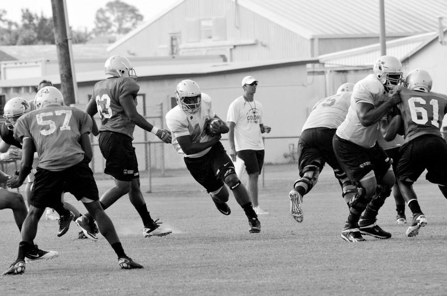 Nicholls running back Marcus Washington running up the middle at last Thursday’s practice.