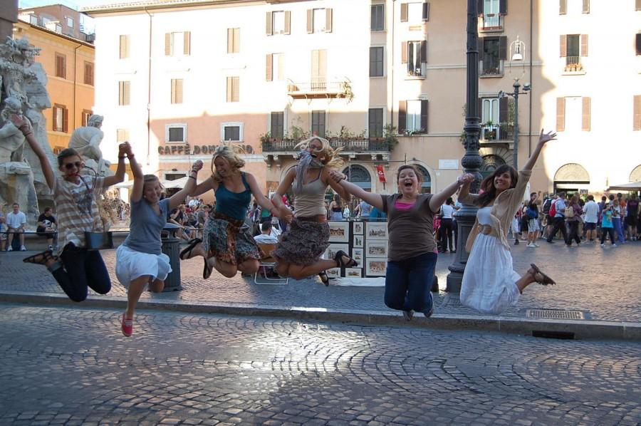 Art students from last year’s trip to Europe jump for joy at the Piazza Navonna in Rome, Italy.