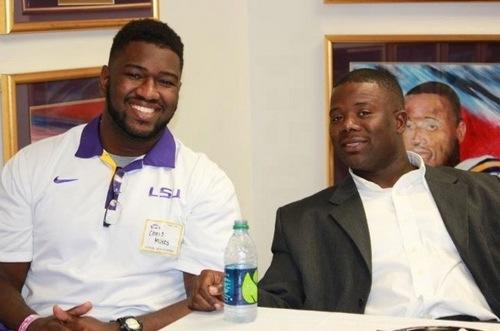 Christopher Mukes, education junior from New Orleans, is all smiles with his uncle Frank Wilson, assistant coach and recruiting coordinator for Louisiana State University.