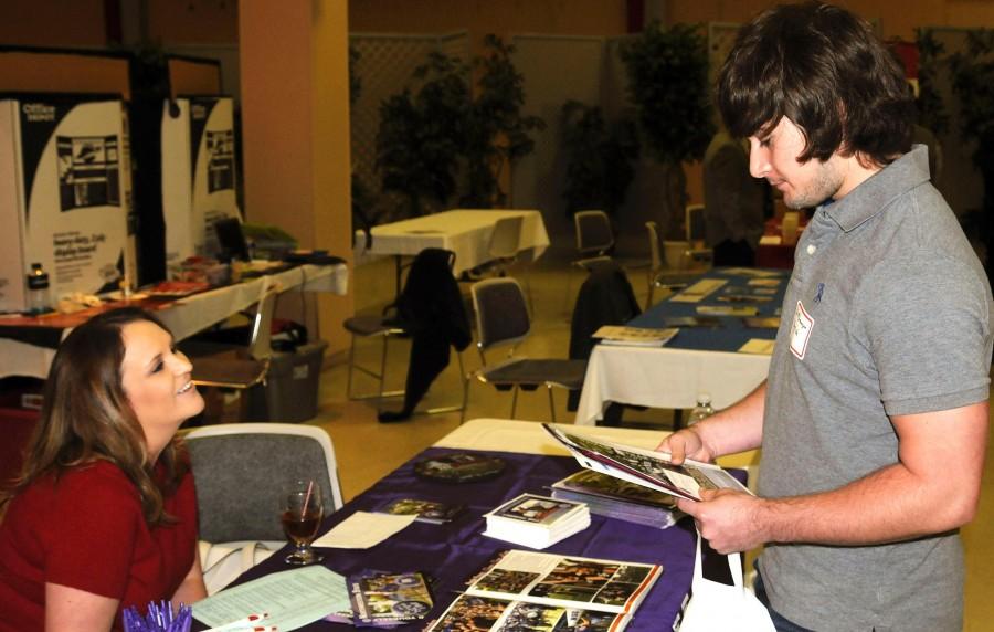 Carolyn Gatti, assistant director of University recruiting graduate & adult studies from Natchitoches, speaks with a graduate hopeful about Northwestern State at NSU Career Day on Sept. 1, 2009.