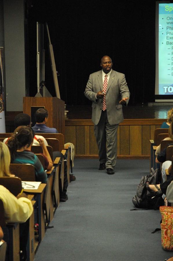 Sidney Reed, special agent and applicant coordinator for the Federal Bureau of Investigation, goes through the special agent applicant process with students Monday in Powell Auditorium. 