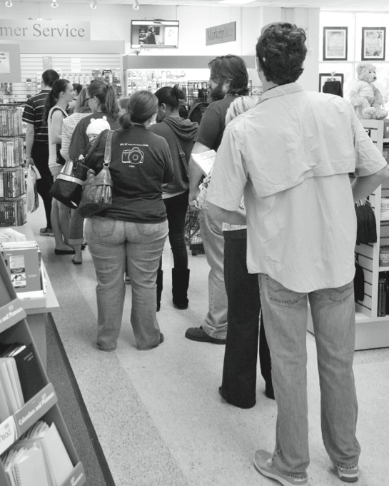 Students wait in line in the bookstore on Tuesday, the day before classes begin.