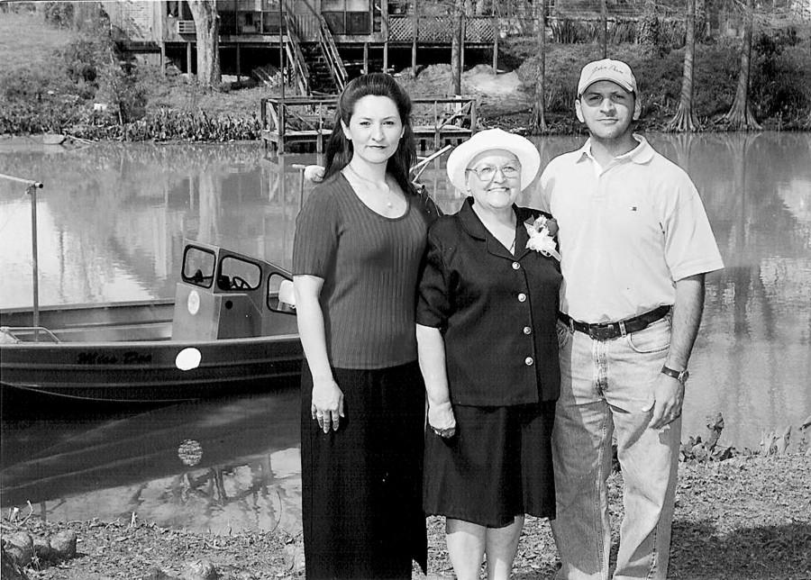 Deanna Bonvillain poses with the boat named after her, Miss Dee, and her children Dana Bonvillain-Aucoin and Dean Bonvillain, Jr.