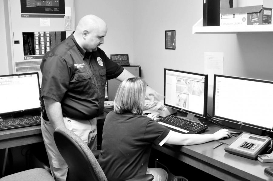 Chief Jaccuzzo of University Police discusses footage from the campus security cameras with P.O. 1 Heather Boudreaux on Jan. 24. Jaccuzzo is a finalist for the National Director Award.