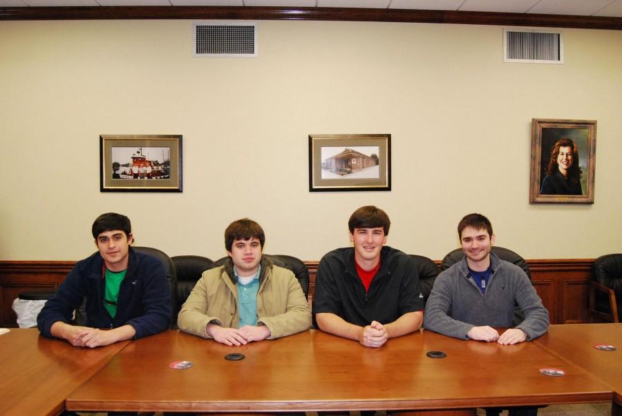 Business team and coordinators met Monday in White Hall to discuss the results of the International Competition. The team ranked in the top 10 of 20 schools. Front row from left, Brett Cazave, graduate student from Vacherie, Brad LeBoeuf, graduate student from Larose, Nolan Dumas, graduate from Thibodaux, and Aaron Ayme, graduate from Destrehan. Not pictured is member Kevin Gibson, finance senior from Houma, and team coordinators Shari Lawrence, associate professor of finance, and John Lajaunie,