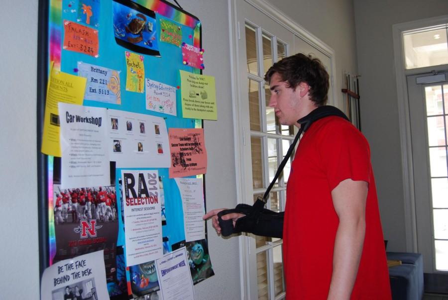 Deshinae Petetant, freshman from Luling, looks at the bulletin board in the La Maison du Bayou Club House on Wednesday.
