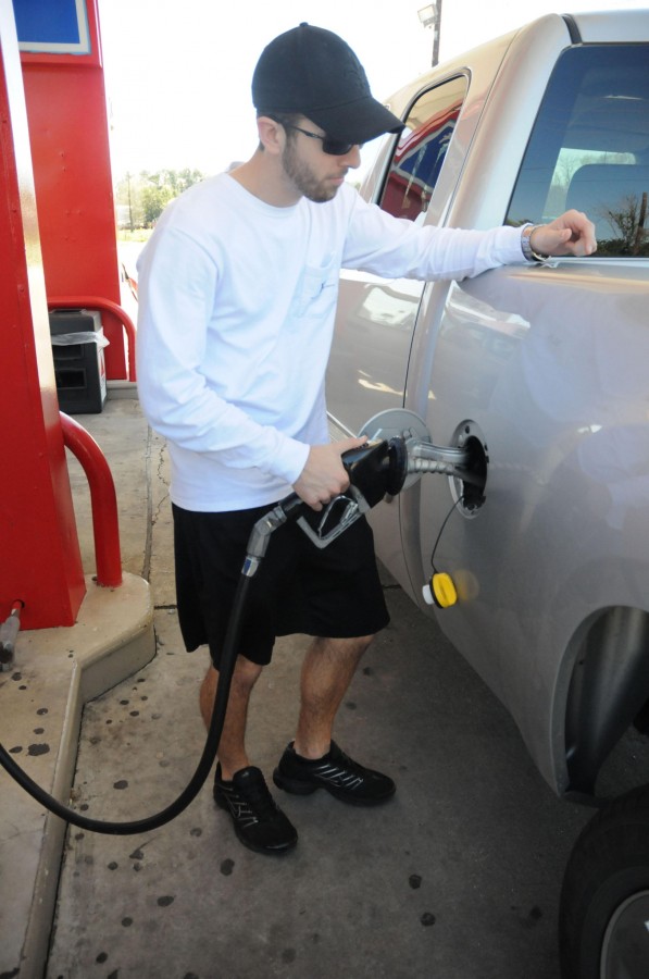 Scott Pellegrin, education junior from Bourg, fills up his truck with gas on Monday afternoon at the Colonel Truck Stop. 