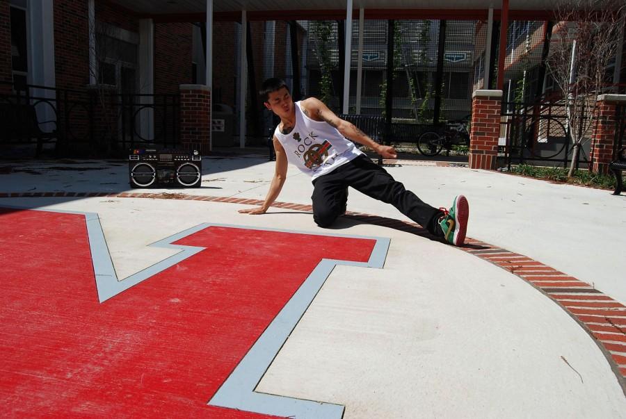 Stephen Pham, marketing junior from Houma, does a hip-hop freestyle and abstract movement combination near Beauregard Hall March 16. Pham said he has been dancing for 11 years and started when he was 10 years old.