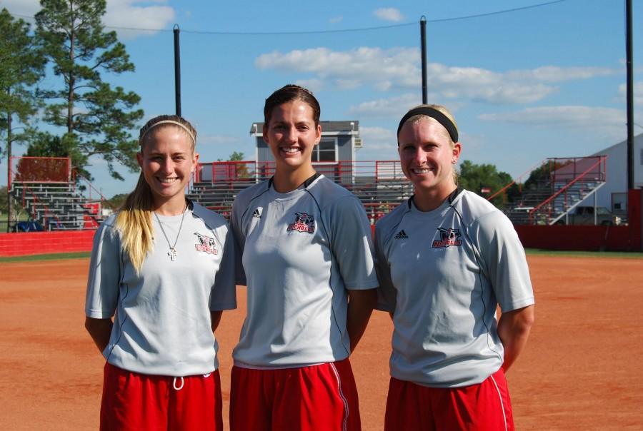 Softball seniors, Megan Gaspard, general studies senior from Coteau, Brittany Ezell, redshirt senior and health sciences junior from Ventress, and Ashley Ray, general studies senior from Lafayette, stand in the softball infield before practice April 19.