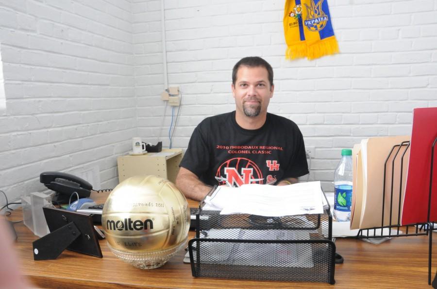 Patrick Hiltz, the new women’s volleyball coach, works in his office in Shaver on Tuesday