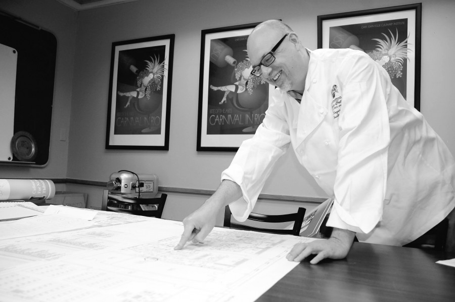 Chef John Kozar, MBOE, department head checks out the official blueprints for the new culinary building on August 17, 2012