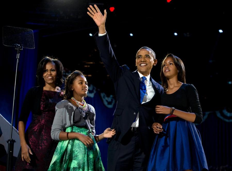 President+Barack+Obama+waves+as+he+walks+on+stage+with+first+lady+Michelle+Obama+and+daughters%2C+Malia+and+Sasha%2C+at+his+election+night+party+Wednesday%2C+Nov.+7%2C+2012%2C+in+Chicago.+Obama+defeated+Republican+challenger+former+Massachusetts+Gov.+Mitt+Romney.+