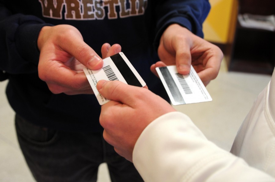 Students swap Colonel Cards to access meal plans, Colonel Cash and dorm hall entrance.