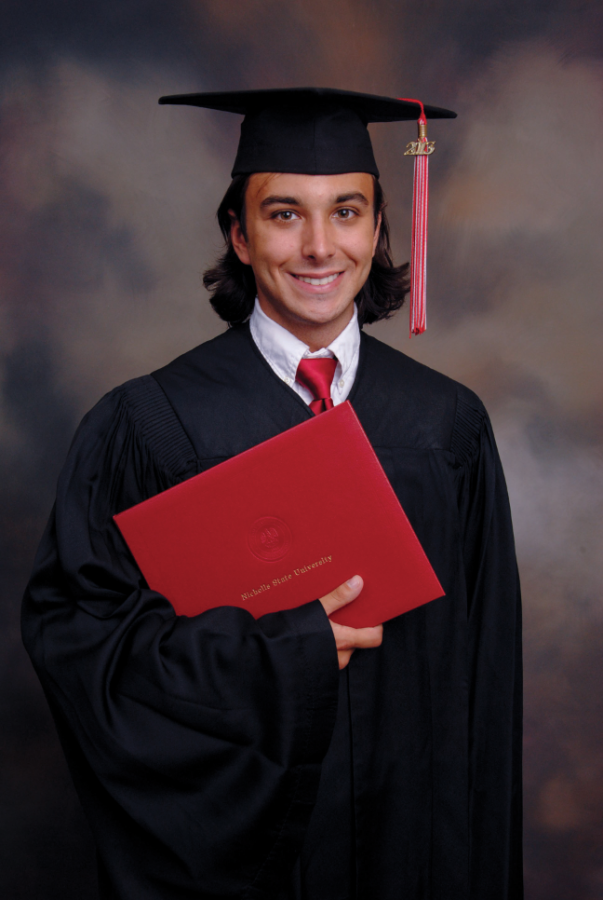 Bryan Matherne poses with his cap and gown last week.