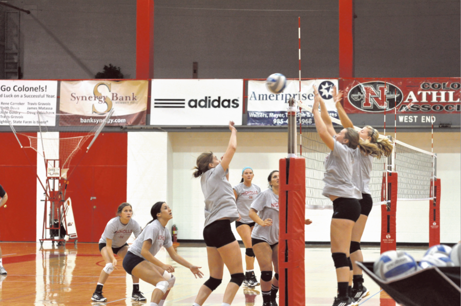 Volleyball players practicing on Friday night.