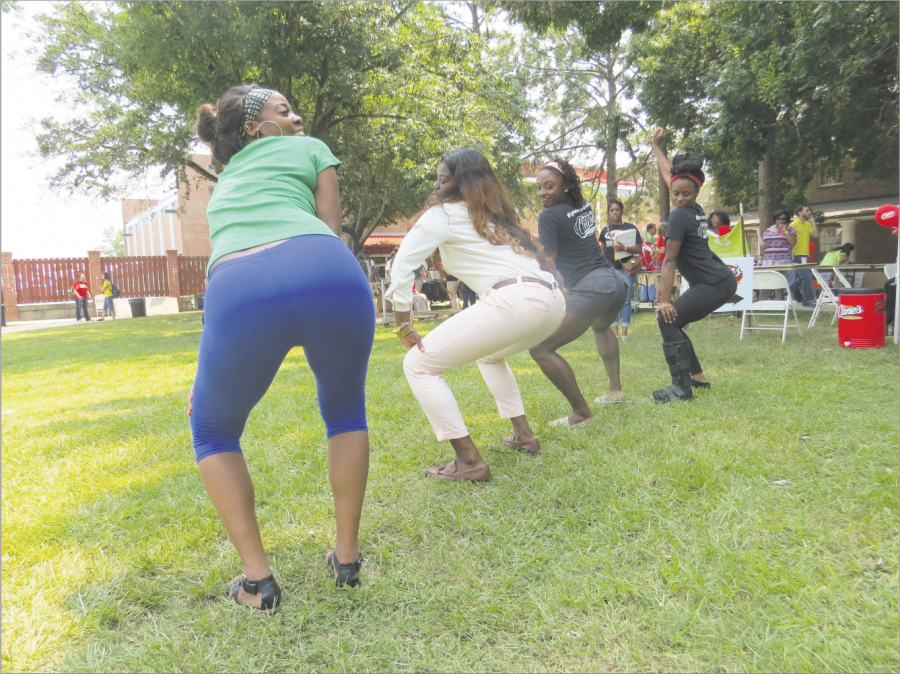 Nikia Major, general studies senior from New Orleans, Brittany Morris, education junior from New Orleans, Rachante Colebrook, biology sophomore from The Bahamas, and Terrian Gauff, nursing sophomore from Laplace, demonstrate how to twerk on Aug. 29 at Welcome Back Day. 