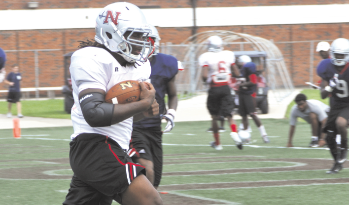 Marcus Washington, #44, a runningback for the Nicholls football team, crosses the goal line after catching a pass during a practice drill in the Colonel Stadium.