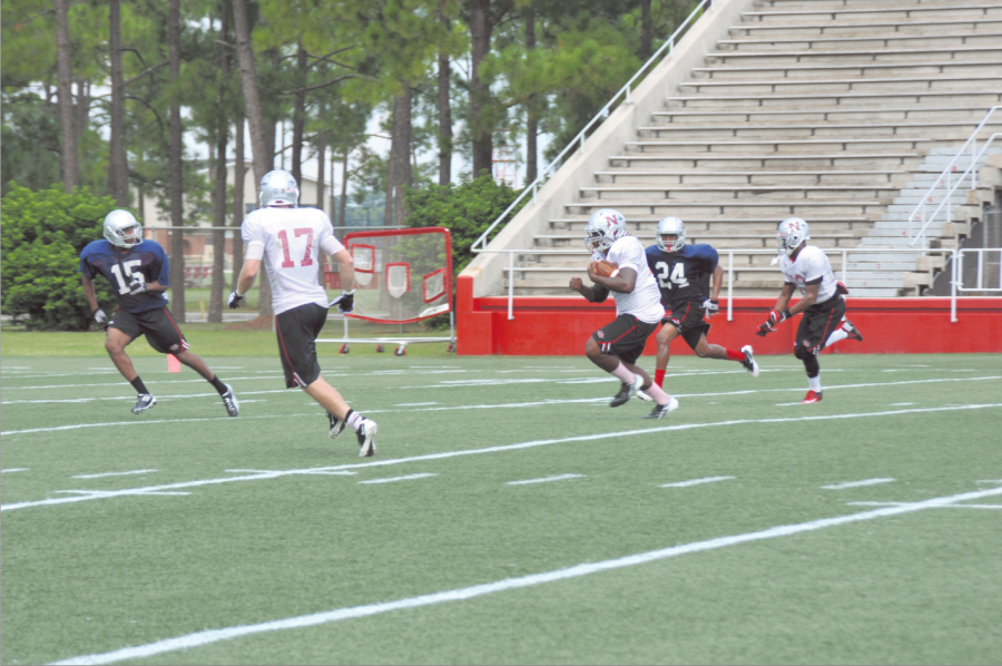 Marcus Washington, #44, a Runningback for the Nicholls football team, runs toward the goal line after catching a pass during a practice drill in Guidry Stadium. 